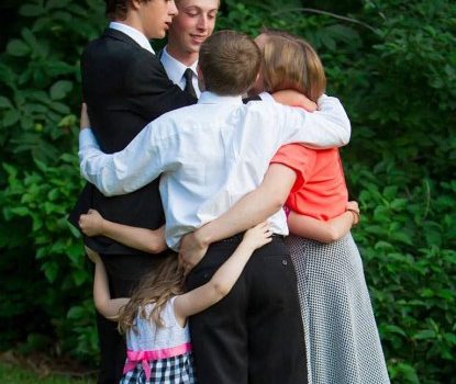 Rachel J. Trotter's six children hugging on each other in an unscripted moment of love.