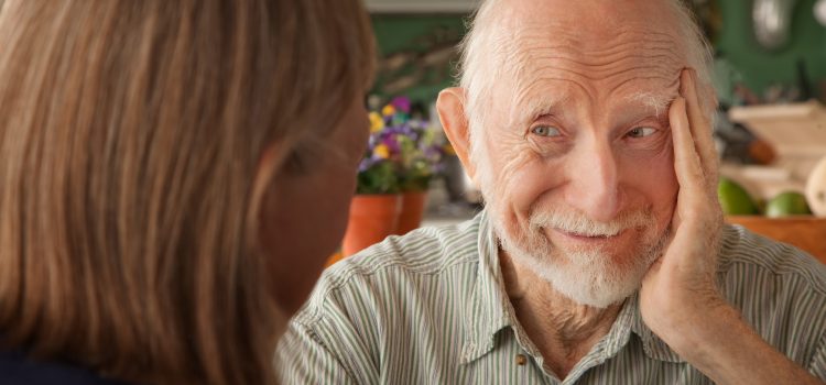 Great life story interviews start with great questions. Photo of a senior man being interviewed.