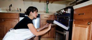 I hope this article on how to transcribe audio makes it a piece of cake. Photo of Rhonda Lauritzen checking a cake in the oven - with a vintage flair