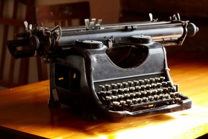 Photo of an old typewriter. TranscribeMe is a great professional service that sure beats the old methods.
