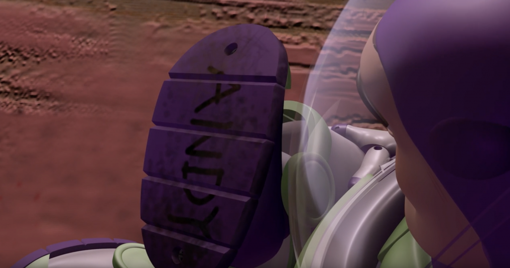 Buzz looks at his boot that is labeled "Andy" and it snaps him out of his darkest hour.