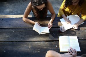 writing groups: an image of three women reading and writing together