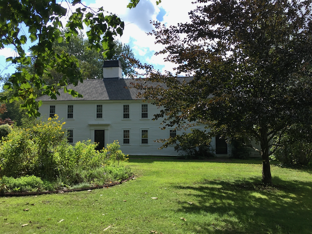 The Tyler-Wood home of Boxford, Massachusetts, a stately white, two-story colonial era house. 
