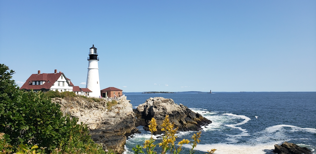 Portland Head Lighthouse, Portland Maine - a picture snapped the last day of our trip showing crashing waves below and blue sky